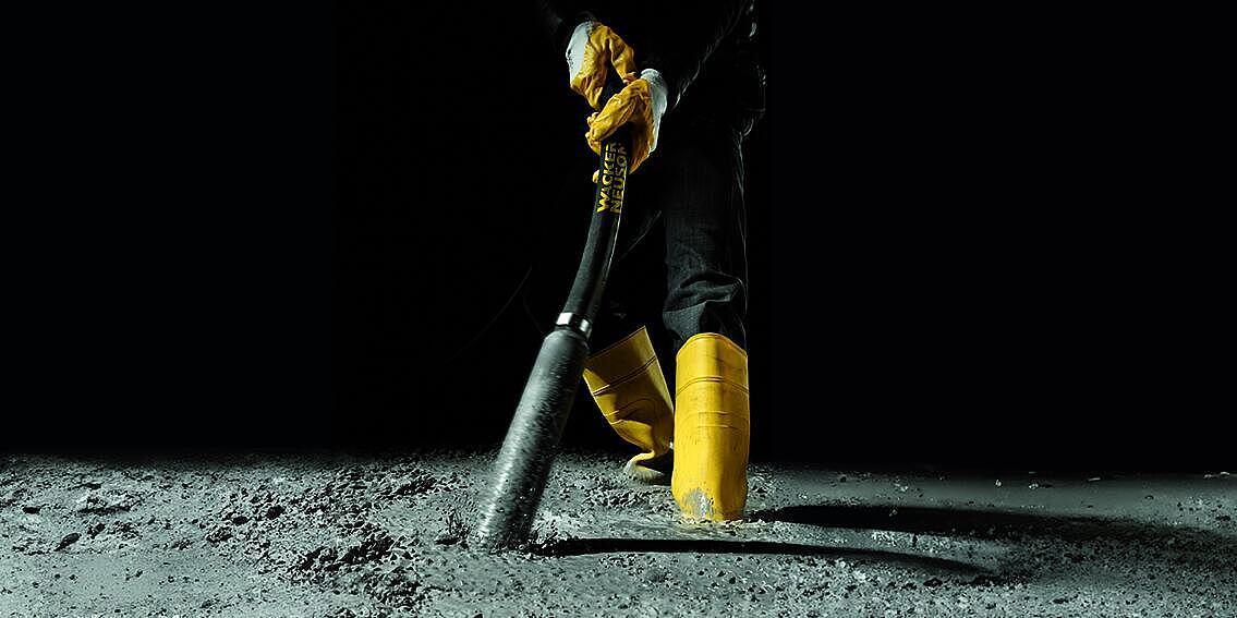 concrete consolidation with an internal vibrator in action